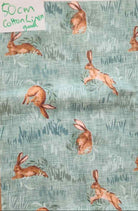 Fabric with rabbit pattern on a green background