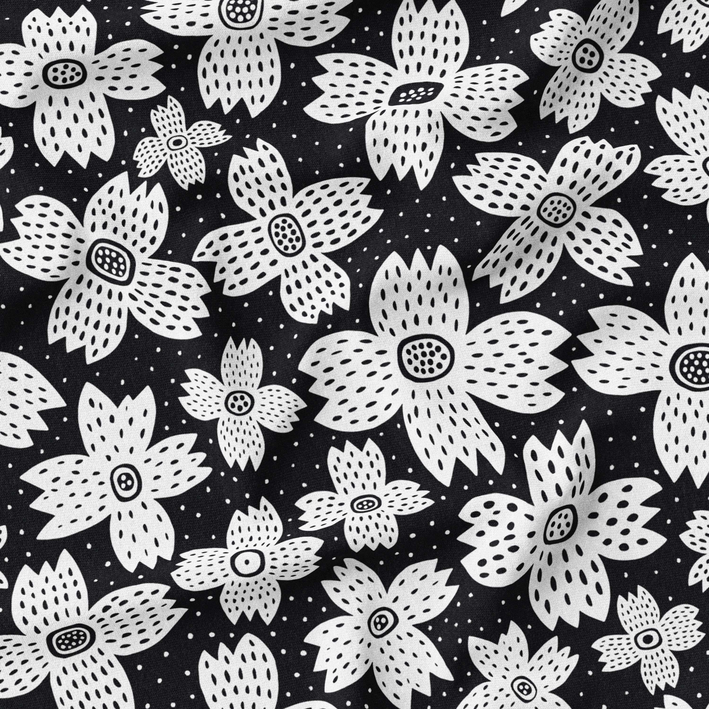 Black and white monochrome daisy print fabric, perfect for versatile fashion and home decor